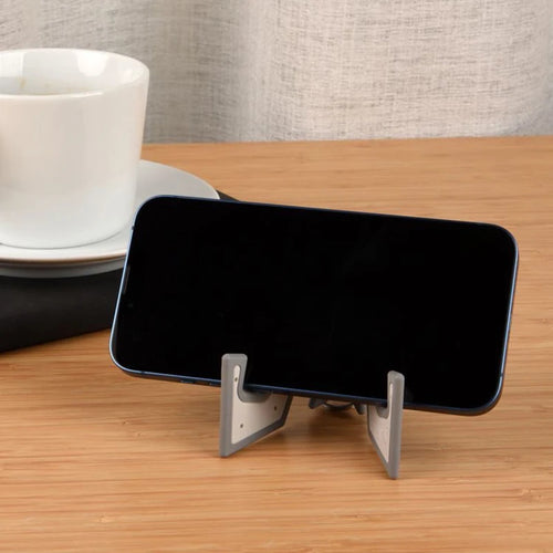 Phone resting sideways on the Tiltvo stand
